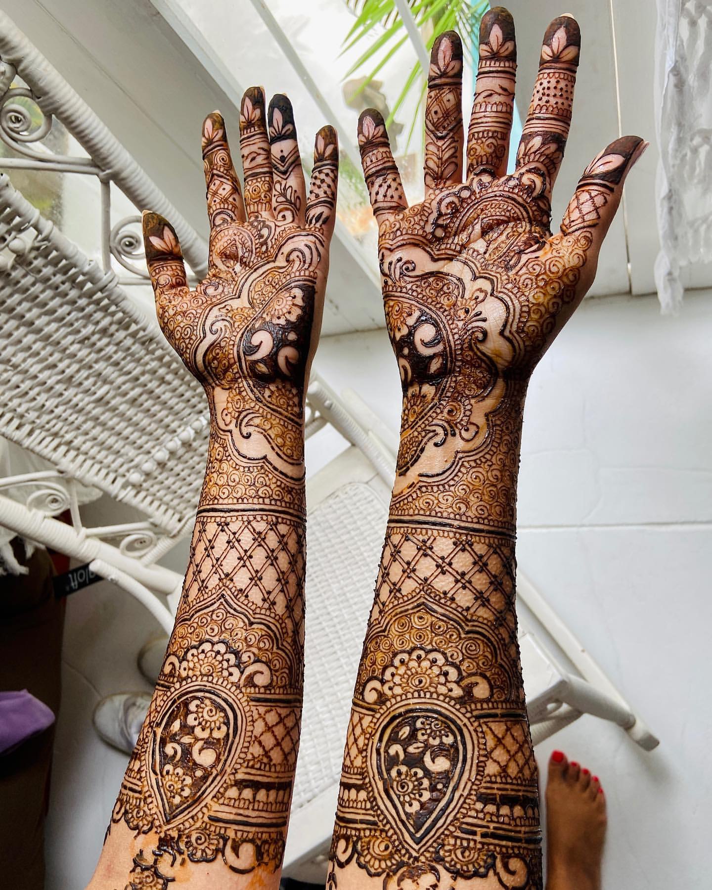 Detailed bridal henna on both hands